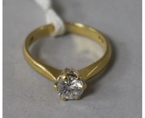 An 18ct gold and solitaire diamond ring, size K.