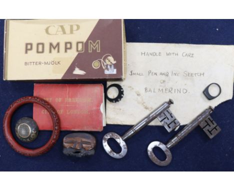 A group of curios including a cinnabar bangle, brooch, rings, keys etc