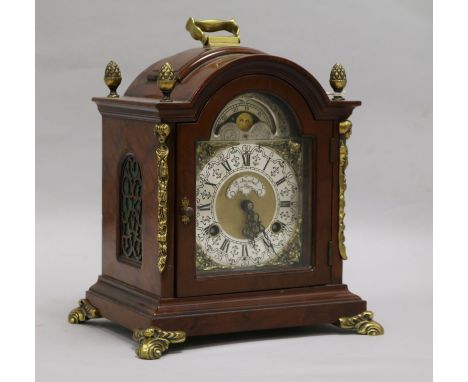 A walnut and brass mounted mantel clock 26cm.