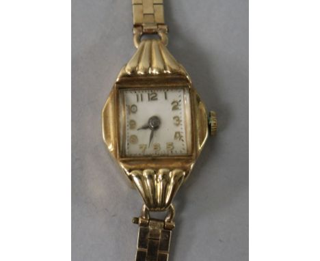 A lady's 9ct gold manual wind wrist watch on a 9ct gold bracelet.
