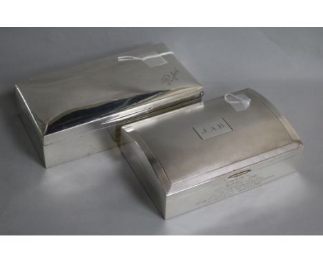 Two large silver cigarette boxes, variously inscribed, one engine-turned