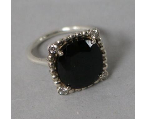 A Tiffany & Co silver, black stone and diamond dress ring, size J.