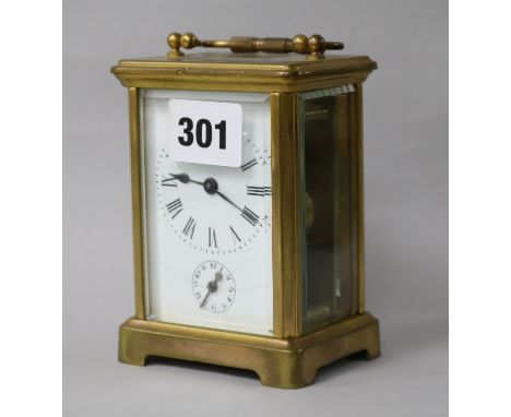 A brass carriage alarm clock 12cm.