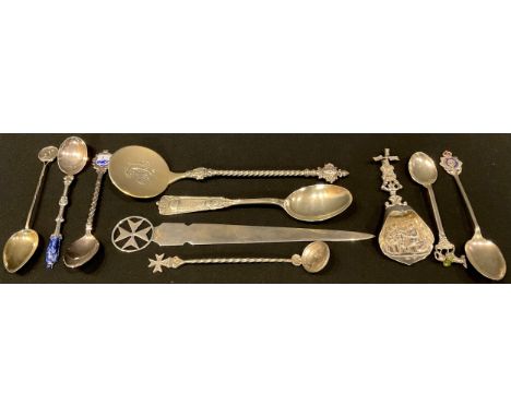 A Maltese silver paperknife, marked 917; a continental silver cocktail spoon, marked 800; a Dutch sterling silver caddy spoon