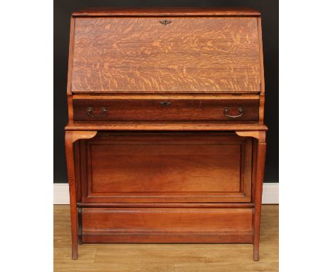 A Globe Wernicke barrister's bureau, fall front enclosing small drawers and pigeonholes above a long frieze drawer and a hing