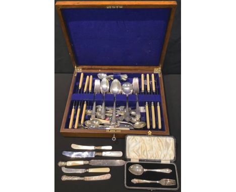 A silver two piece christening set; EPNS flatware in an oak case 