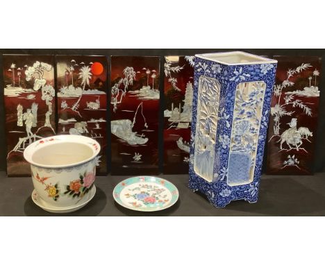 A Chinese export ware pierced stick stand, decorated in underglaze blue, 54cm high; a set of six lacquered panels, inlaid wit