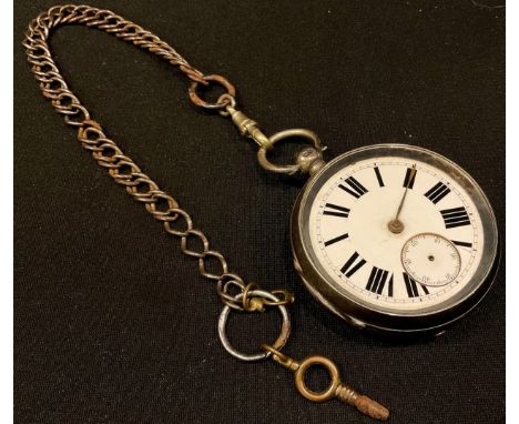 A silver open face pocket watch, white enamel dial, Roman numerals, metal Albert chain 