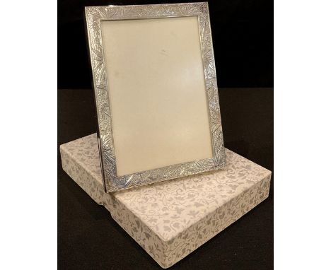 A Chinese silver photograph frame, engraved with leafy bamboo, 14.5cm high, retailed by Waikee, Hong Kong, boxed 