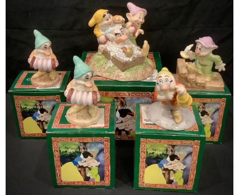 A Royal Doulton Walt Disney's Classic Snow White model, Grumpy's Bathtime, SW20, 10.5cm high, boxed; others, Doc With Lantern