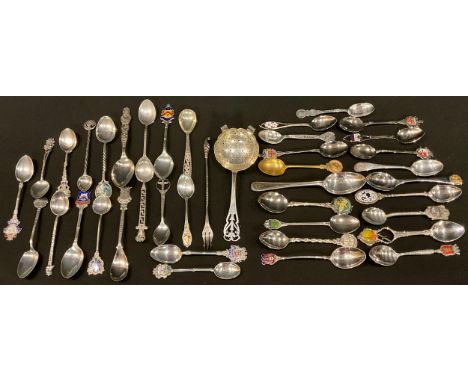 A Victorian Art Nouveau silver tea strainer, Walker and Hall, Sheffield 1889; a Victorian silver pickle fork, Birmingham 1899