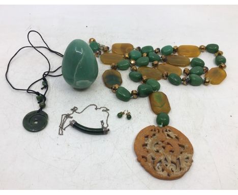 A&nbsp; jade egg together with jade necklaces and earrings&nbsp;