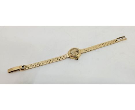 A gold Bucherer ladies' bracelet watch, manual movement, having signed circular dial with baton hour markers, 16mm wide case 