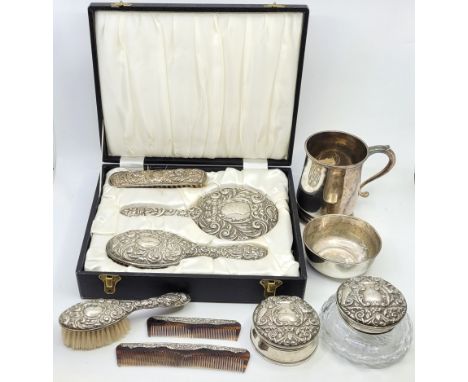 A three piece silver mounted dressing table set, by Broadway &amp; Co, Birmingham 1976, comprising hand mirror, hair and clot