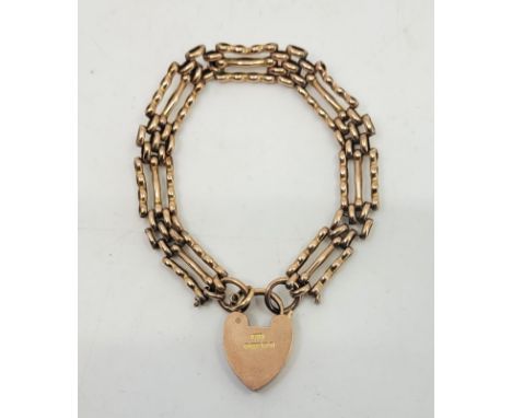 A 9ct. rose gold gate bracelet, with 9ct. rose gold heart padlock clasp. (14.8g)  