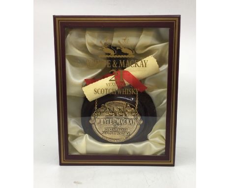 A vintage bottle of Whyte &amp; Mackay 21 yr old Scotch Whisky in presentation box with scroll.