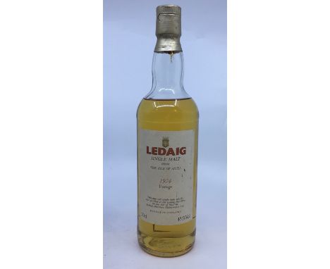 Whisky, Ledaig single malt from The Isle of Mull, 1974 vintage, level on top of shoulder, seal in tact.