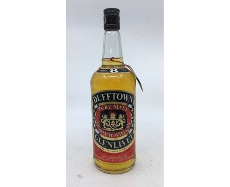 Dufftown Glenlivet 8 years old pure malt scotch whisky, 1 litre. Level towards bottom of neck, seal in tact.&nbsp;