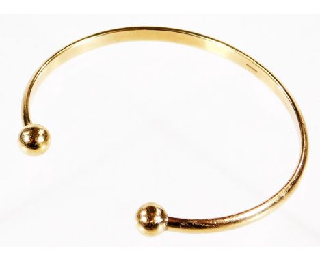 A 9ct gold torc bangle, maker's stamp AJLD, 16.1g all in, 7cm Dia.