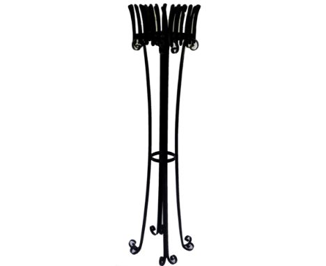 A metal jardiniere planter, with meshwork top on inverted scroll legs, with scroll supports, painted black, 134cm H.