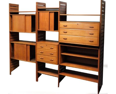 A vintage teak Ladderax cabinet set, with ladder sides and several cupboards with articulated doors, with metal fixings and s