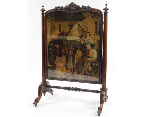 A Victorian rosewood firescreen, the centre embroidered with a scene of horses, ladies and farrier, in a heavily carved frame