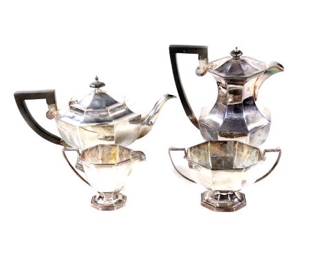 A silver four piece tea service, of hexagonal form with ebonised knop handle on a tapering base, made by Walker &amp; Hall, S