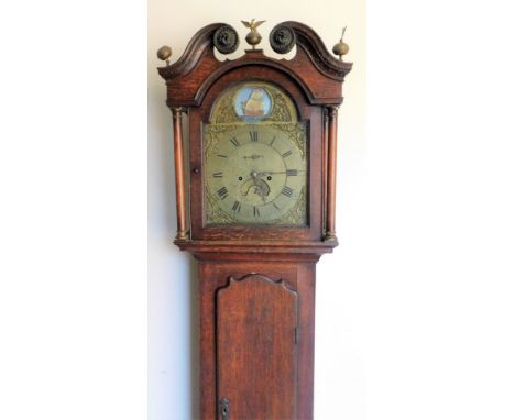 A late 18thC oak longcase clock, with a broken swan neck pedimented hood surmounted by eagle and orb finials, above a long tr