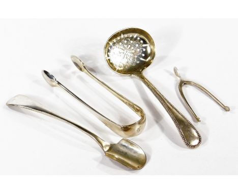 A Victorian beaded silver sugar sifting spoon, crest and monogram engraved, Josiah Williams &amp; Co., Exeter 1864, pair of G