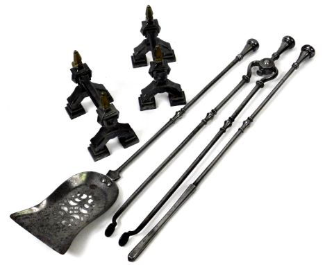A set of three late 18thC/early 19thC steel fire irons, with a pierced shovel, poker and tongs, and associated pair of fire d