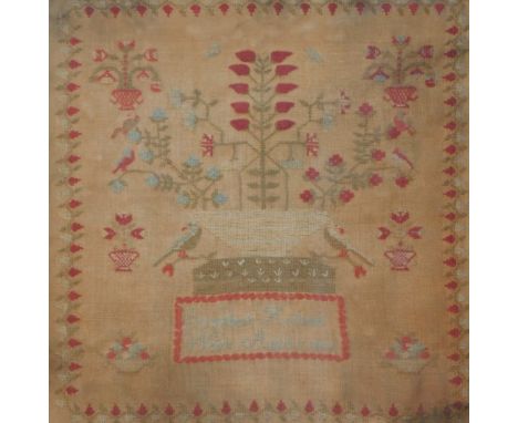A 19thC needlework sampler, by Elizabeth Holland with floral motifs and birds, 39cm x 40cm in moulded ebonised frame.