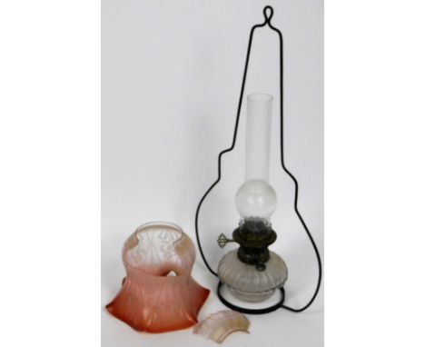 A Victorian hanging oil lamp, the part Cranberry tinted shade decorated with flowers, etc., in Art Nouveau style, with superi