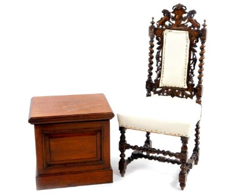 A oak Carolean style chair, with carved lion and scroll cresting rail above an overstuffed back and seat, with turned support