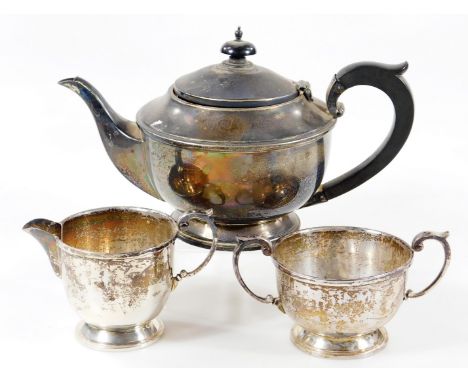 A George V silver three piece tea service, comprising of teapot, 15cm H,milk jug and two handled sugar bowl, Birmingham 1936,