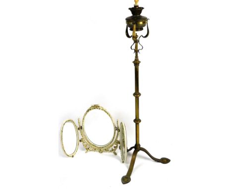 An early 20thC brass telescopic standard lamp, with removable top gas burner, converted to electricity, on a turned stem term