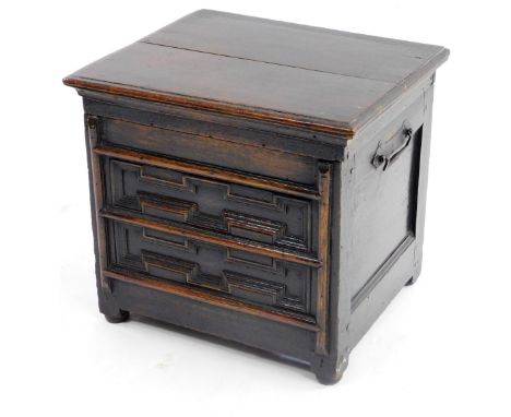 A late 17thC/early 18thC oak box commode, the hinged rectangular lid with a moulded edge enclosing a vacant interior, with a 