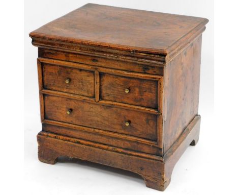 A late 17thC/early 18thC oak box commode, with a rectangular hinged top with a moulded edge, enclosing a vacant interior, the