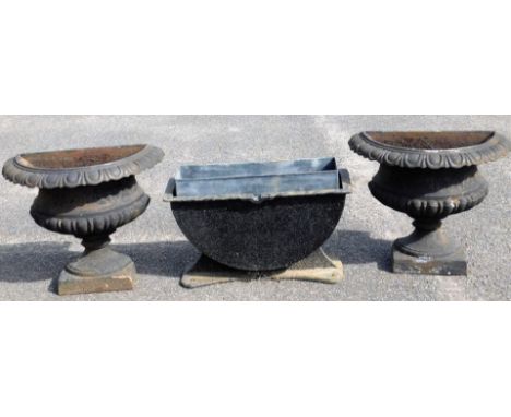 A pair of demi-lune garden planters, each with upper egg and dart decoration, partial gadrooned bodies and rectangular bases,