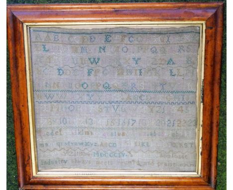 A 19thC needlework sampler, with lines of alphabetical and numerical samples and motto 'Industry always meets reward and prai