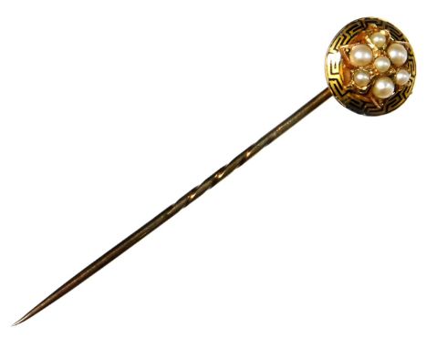 A Victorian stick pin, set with black enamel and seed pearl decoration, the central seed pearl cluster surrounded by black en