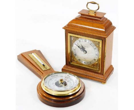 An Elliott &amp; Hopper mantel clock, the polished dome case surmounted by a metal handle, on compressed bun feet, the 8.5cm 