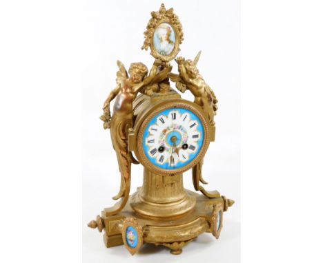 A 19thC French gilt metal and Sevres style mantel clock, the heavily cast case set with cherubs and surmounted by an oval por
