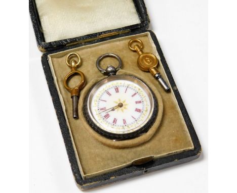 A silver fob watch, with white enamel dial, set with gold coloured borders and centre, with blue and red enamel Roman numeral