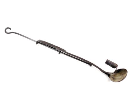 An unusual wrought iron rush light and candle, with hanging loop and domed sconce, cylindrical candle holder, 70cm L.