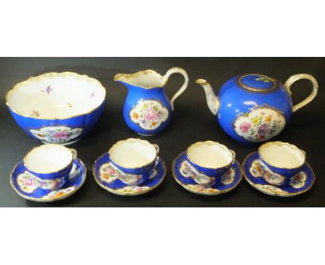 A 19th Century Meissen part tea set, royal blue ground with gilt lining and panels of floral sprays with insects, comprising 