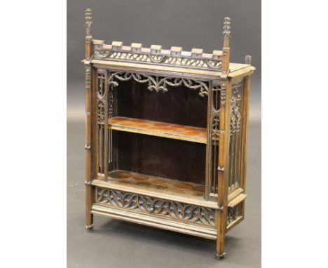 A 19th Century French Gothic style oak wall hanging cabinet with open shelf within ornate carved panels over a single drawer,