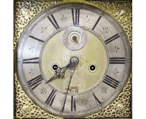 An early 18th Century oak cased long case clock with later carved decoration, the door with study of sailor and pond yacht, r