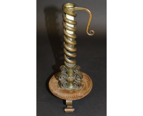 An Arts and Crafts gilded brass spiral twisted candlestick, the base marked "T. Potter & Sons 44. South Molton St London. W."