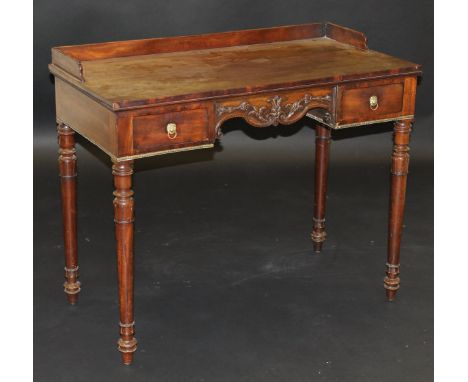 An early Victorian mahogany wash stand, the three quarter galleried top above foliate moulded centre frieze flanked by two dr