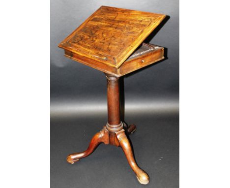 A George III mahogany reading table, the plain top with pop-up book rest rising on a ratchet flanked by candle slide and stat